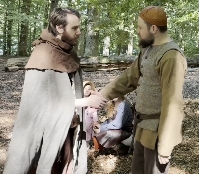 Tv&aring; b&ouml;nder g&ouml;r ett handslag